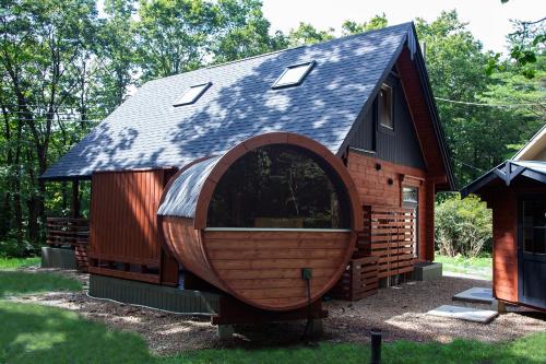 a tiny house with a gambrel roof at LEVATA in Nasu