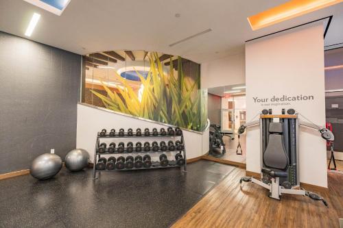 a room with a gym with a bunch of exercise equipment at EVEN Hotel New York - Midtown East by IHG in New York