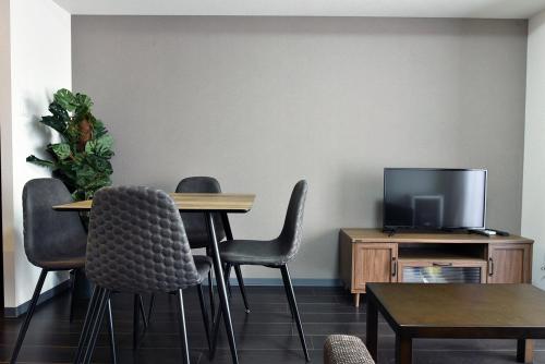 TV a/nebo společenská místnost v ubytování Sun Court Hongodori Garden Hills