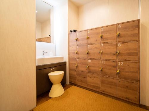 a bathroom with a toilet and a sink at Super Hotel Tokyo JR Tachikawa Kitaguchi in Tachikawa