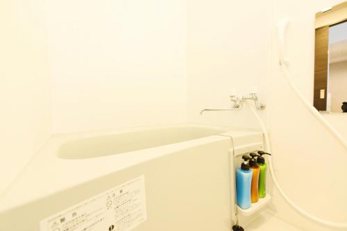 a bathroom with a sink and a faucet at Sun Court Hondori Garden Hills in Tsukisappu