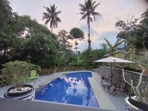 Bazén v ubytování Villa Dikawah Ratu 1000m2 nebo v jeho okolí
