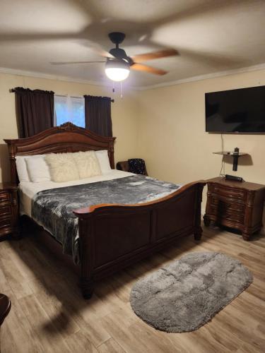 a bedroom with a bed and a ceiling fan at 11onEssex1 in the heart of Kingston Ja DN Vacations in Kingston