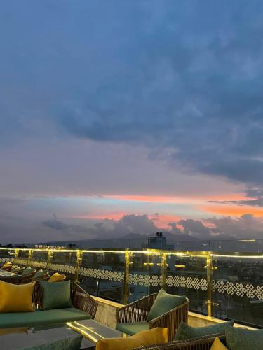a group of couches on the roof of a building at Kathmandu Height Boutique Hotel in Kathmandu