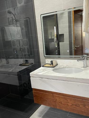 a bathroom with a sink and a shower at Wyndham Luxury Villa Vân Đồn 