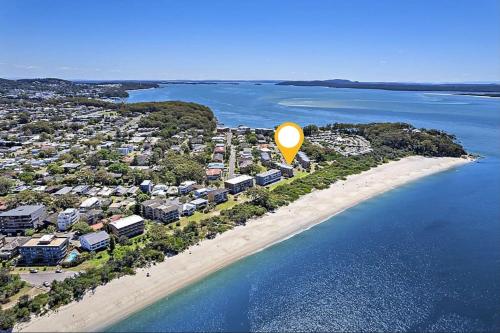 an aerial view of a beach with a yellow balloon at 'Serenity Now' Shoal Bay Beach Front with All Linen, WiFi and Air Con in Nelson Bay