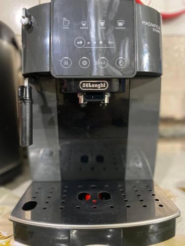 a coffee maker with a camera on top of it at Bukhara Zaringiz PREMIUM in Bukhara