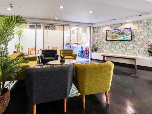 a waiting room with chairs and a table at Stay Hotel Waikiki in Honolulu