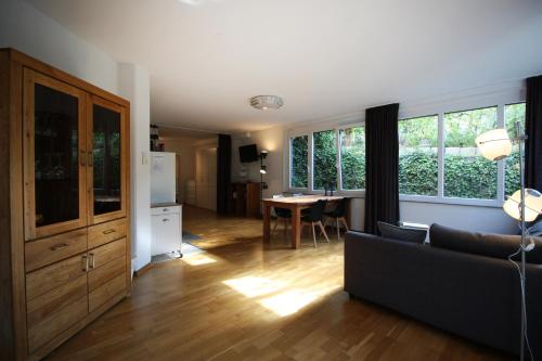 a living room with a couch and a table at Konstanzer Ferienwohnungen in Konstanz