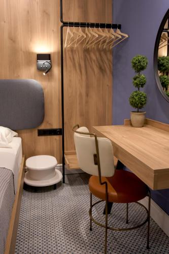 a room with a bed and a desk and a chair at XANTHI POLIS CITY CENTER with private parking in Xanthi