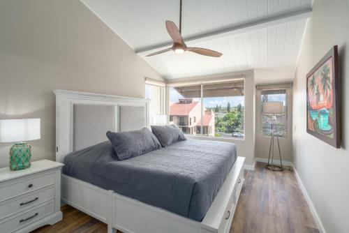 a bedroom with a bed and a ceiling fan at 337 Hale Kamaole in Wailea