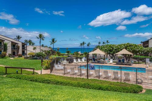 a resort with a swimming pool and the ocean at 337 Hale Kamaole in Wailea
