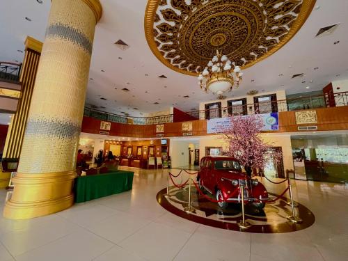 a shopping mall with a red car in the middle at Golden View Hotel in Nagoya