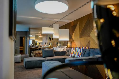 a living room with a couch and a bed at Yaremche Club Hotel in Yaremche