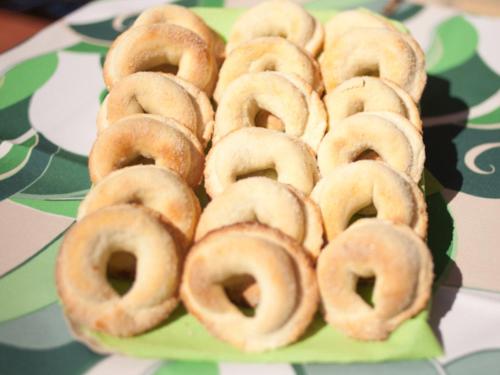 a pile of donuts on a plate on a table at B&B La Collina in Vasto