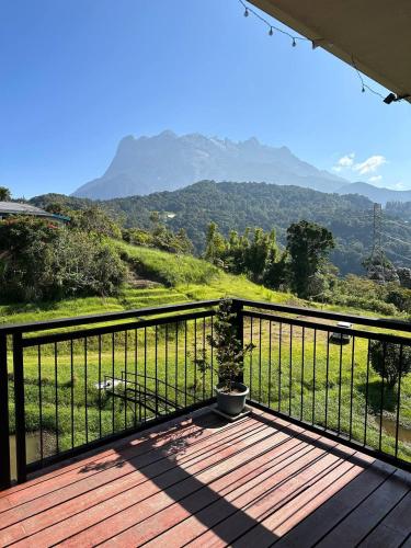 a balcony with a view of a mountain at GEORGE ADVENTURE BASE BUNDU TUHAN 
