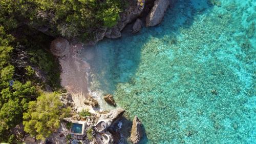 an aerial view of a beach with turquoise water at Luxury 12-Guest Villa in Gated Community with Pool, Ocean View & Private Beach Access in Willibrordus