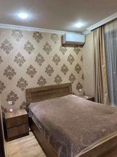 Una cama o camas en una habitación de Ananiko