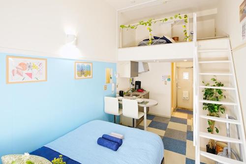 a bedroom with a bunk bed and a kitchen at SC101 - Tokyo Stay Easy Access to Asakusa & Skytree in Tokyo