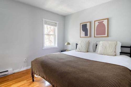 a bedroom with a large bed and a window at South Boston 2br w building wd nr seaport BOS-914 in Boston