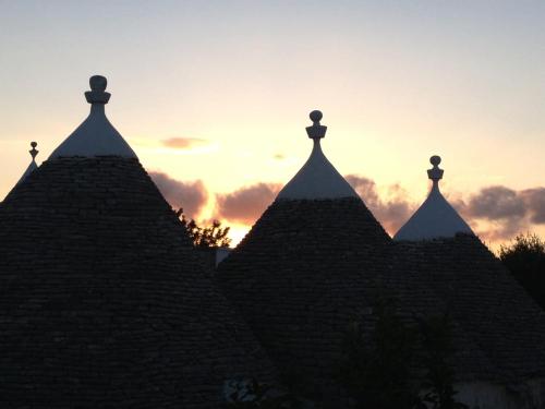 a view of the spires of a building at sunset at Aria di Casa Country Resort in Alberobello