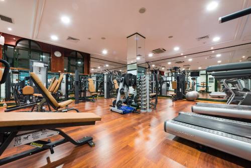 a gym with several treadmills and exercise equipment at Hotel Villa Breg in Vršac
