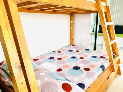 a bunk bed with a polka dot mattress at Tagaytay Staycation in Tagaytay