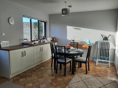 A kitchen or kitchenette at Ger's Lodging