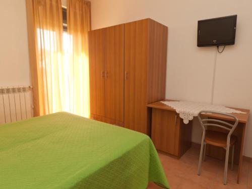 TV a/nebo společenská místnost v ubytování B&B La Collina