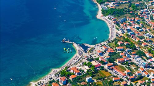 an aerial view of a beach with houses and the water at Number One Apartments in Vir