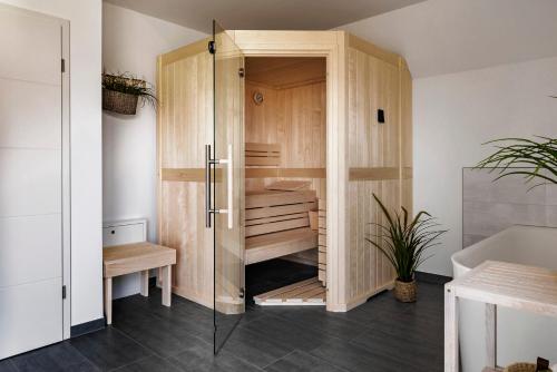 a bathroom with a wooden closet with a desk at Haus Traubeneiche in Büsum