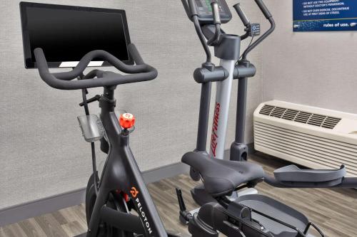 a bike in a room with a computer on it at Hampton Inn & Suites Cape Coral / Fort Myers in Cape Coral