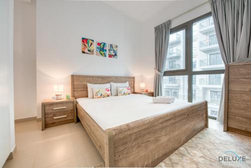 Postel nebo postele na pokoji v ubytování Welcoming 1BR at Town Square Safi Dubailand by Deluxe Holiday homes