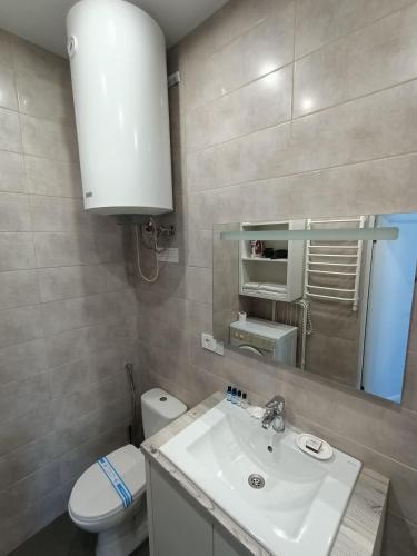 Ένα μπάνιο στο Apartments Bis House