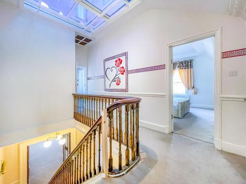 a hallway with a staircase in a house at *RA9bC* For your most relaxed & Cosy stay + Free Parking + Free Fast WiFi * in Moortown