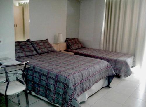 En eller flere senge i et værelse på Flat Tambaú frente mar