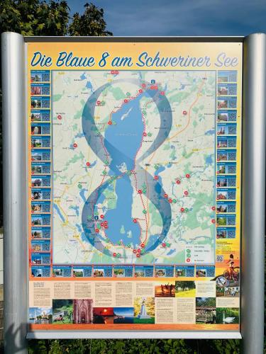 a large sign with a map on it at Blaue 8 in Rampe