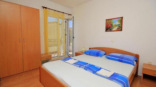Ένα ή περισσότερα κρεβάτια σε δωμάτιο στο Apartment Makarska M&I
