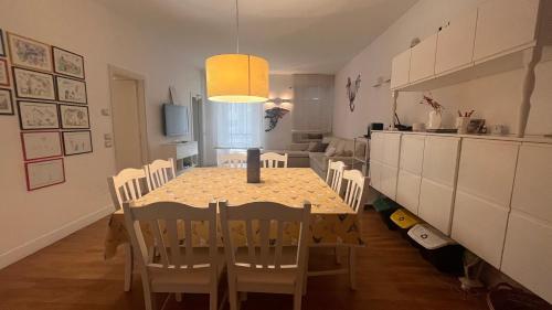 a kitchen and dining room with a table and chairs at A casa di Don Remo in Agnone