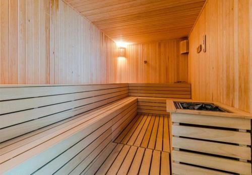 a sauna with wood paneling and a wooden floor at 33 floor, luxury apartment, amazing view Sky City Cevahir-Skopje in Skopje