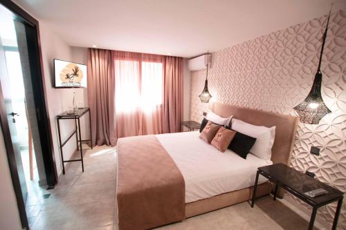 Postel nebo postele na pokoji v ubytování Riad La Petite Majorelle