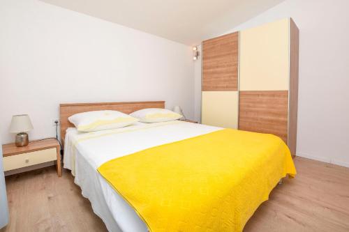 Ένα ή περισσότερα κρεβάτια σε δωμάτιο στο Apartments Branko