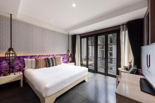 Cama o camas de una habitación en U Chiang Mai