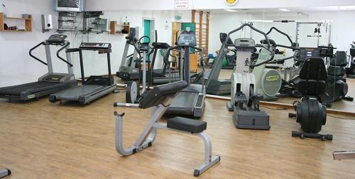 a gym with several treadmills and exercise bikes at Suite Paradise - D111 in Caesarea