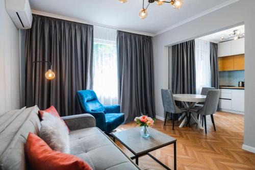 a living room with a couch and a table at Lozenets Apartment in Sofia