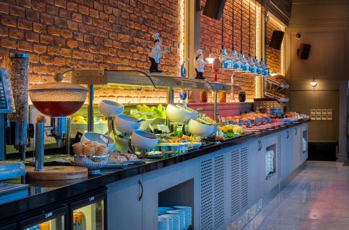 a buffet line with bowls and dishes on it at Port Bosphorus in Istanbul