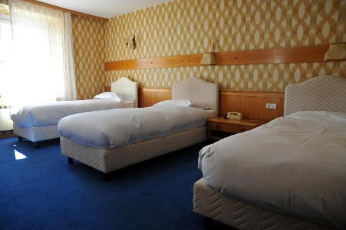 Hotel Passo Stelvio 객실 침대