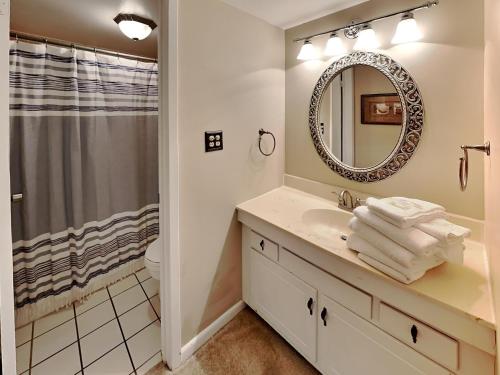 a bathroom with a sink and a mirror at Emerald Isle fort Walton Beach 209 in Fort Walton Beach