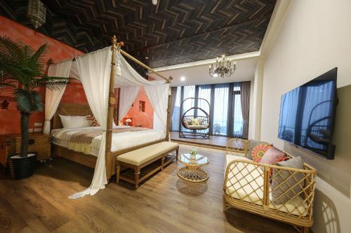 a bedroom with a canopy bed and a living room at 玉蘭函館民宿Yulan Hokodate in Datong