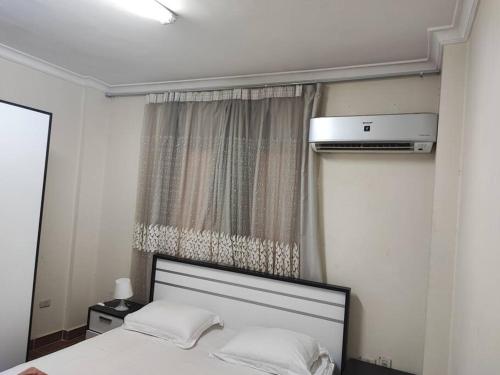 Ένα ή περισσότερα κρεβάτια σε δωμάτιο στο Italian Square Apartment